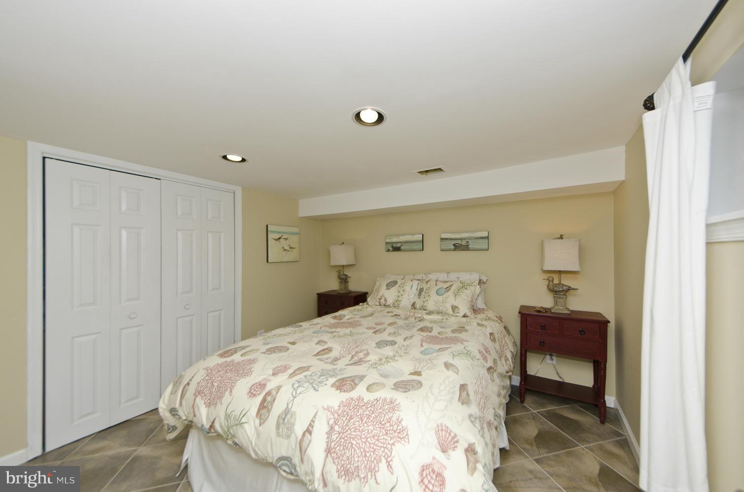 5700 25th Road North Arlington, VA 22207 - Photo 23 of 29 a bedroom with a bed and a chair