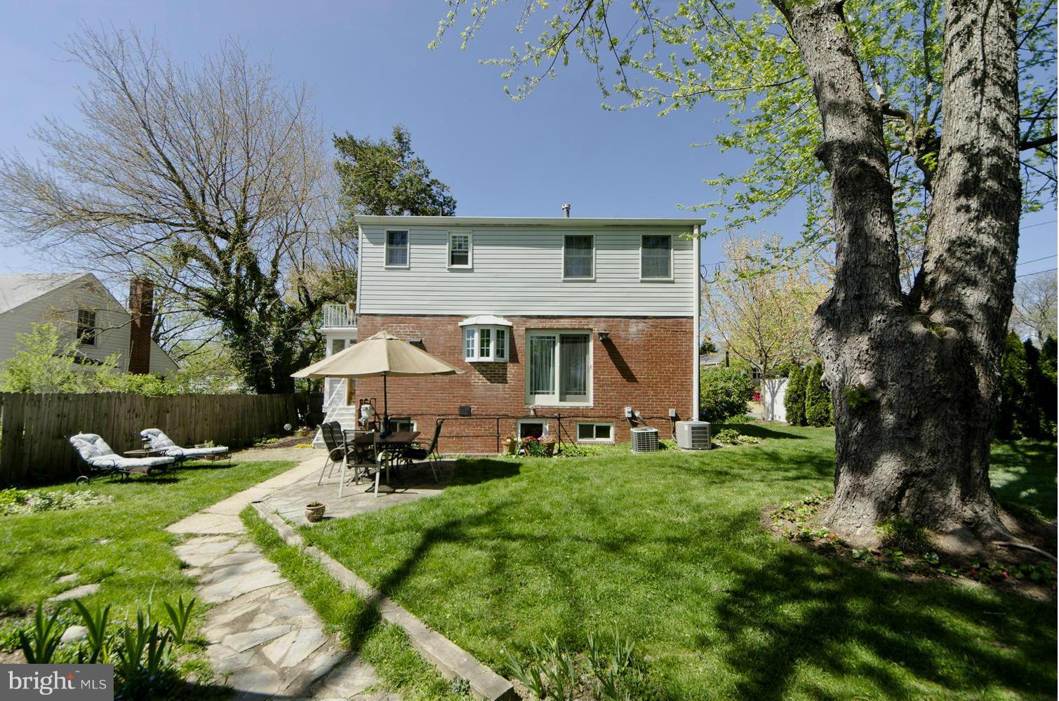5700 25th Road North Arlington, VA 22207 - Photo 26 of 29 a front view of a house with a yard porch and sitting area