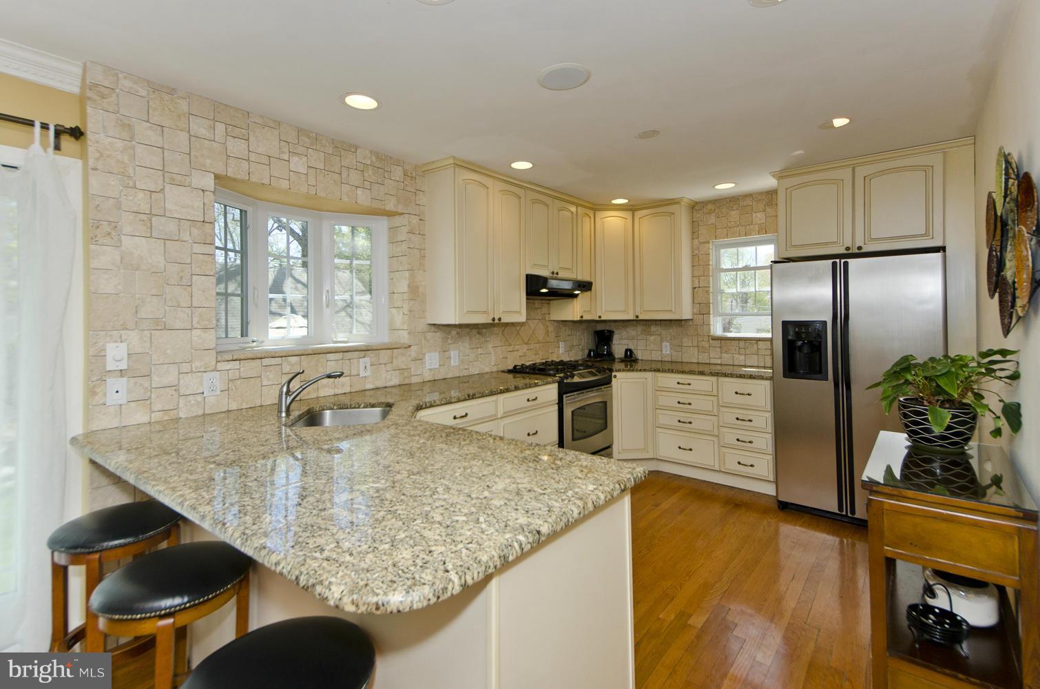 5700 25th Road North Arlington, VA 22207 - Photo 10 of 29 a kitchen with stainless steel appliances granite countertop a sink refrigerator and cabinets