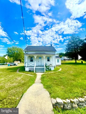 a view of a house with a big yard