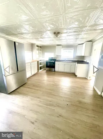 a view of a kitchen with furniture and a kitchen