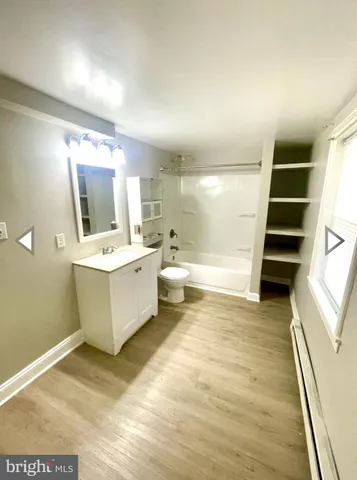 a bathroom with a sink a mirror and a bathtub
