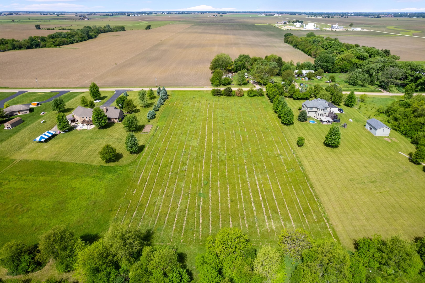 Lot 2 Oakbrook Road Newark, IL 60541 - Photo 7 of 11 a view of a lake with a building in the background