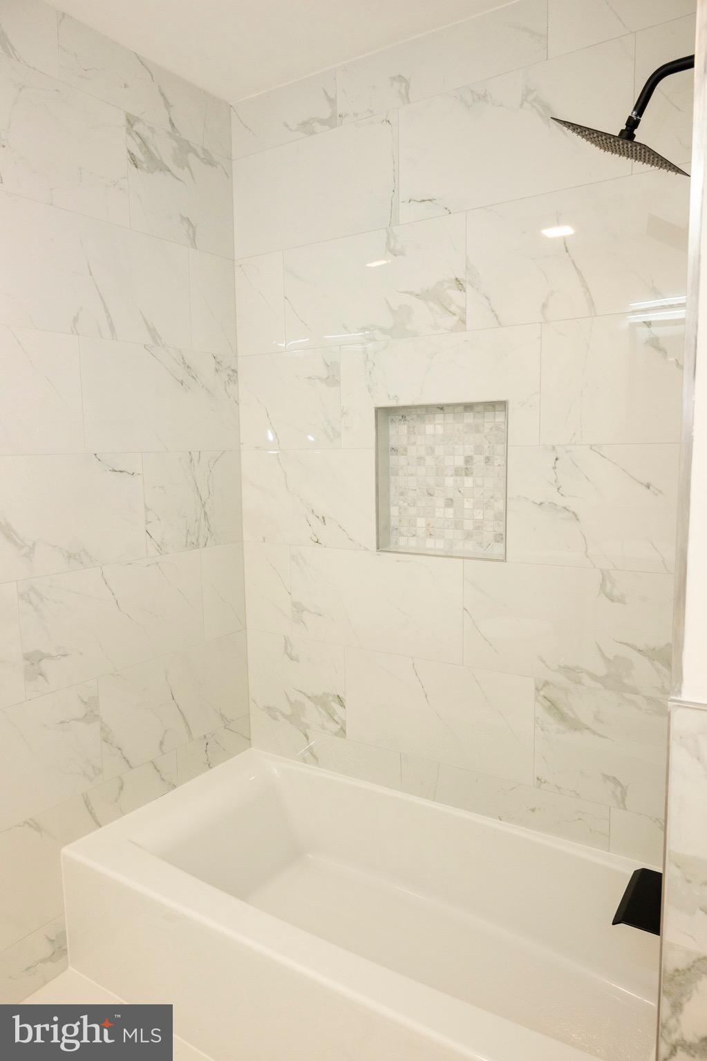 2201 Strahle Street, Unit D3 Philadelphia, PA 19152 - Photo 2 of 21 a bathroom with a bathtub and shower