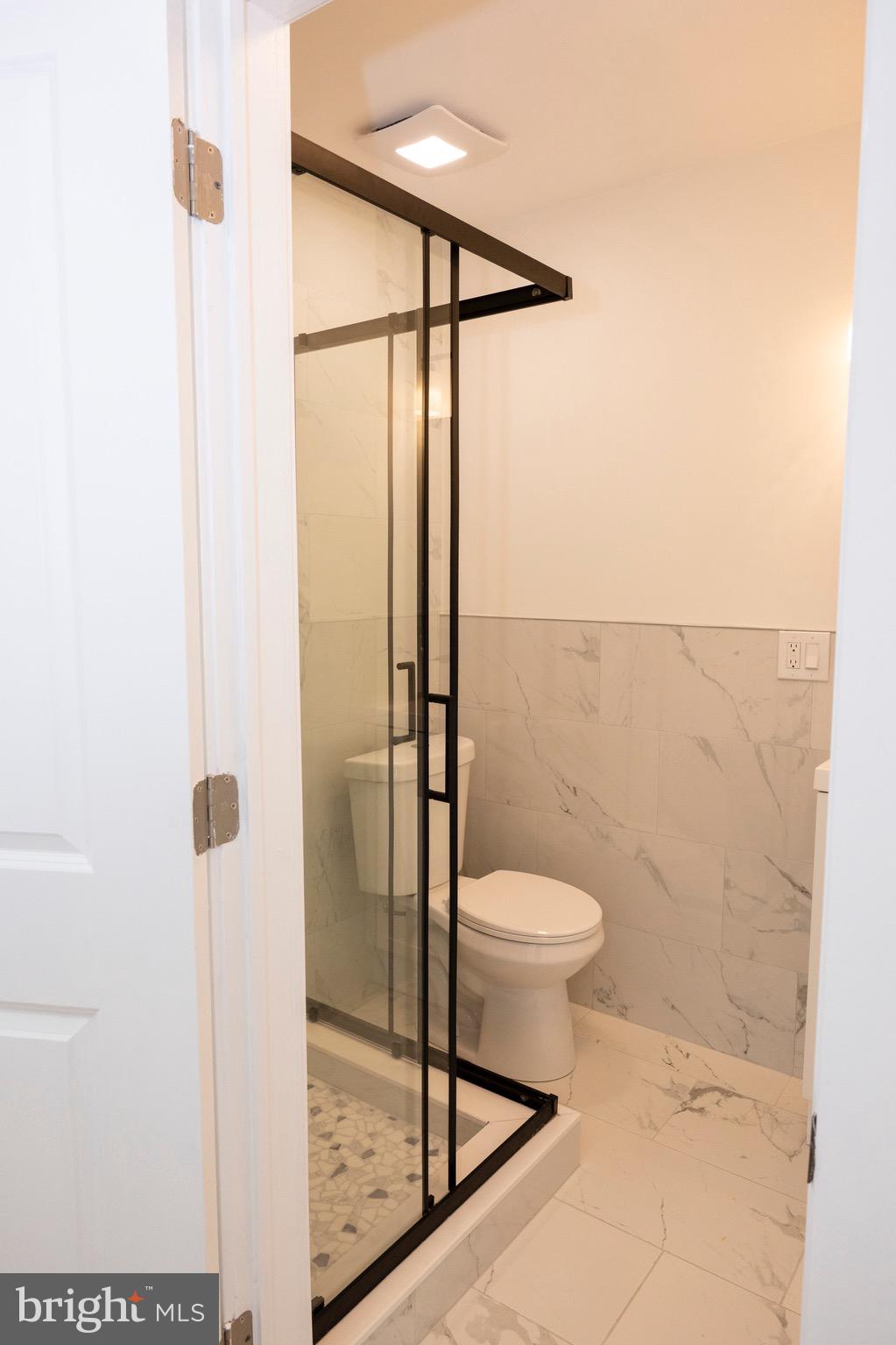 2201 Strahle Street, Unit D3 Philadelphia, PA 19152 - Photo 9 of 21 a bathroom with a toilet and a shower