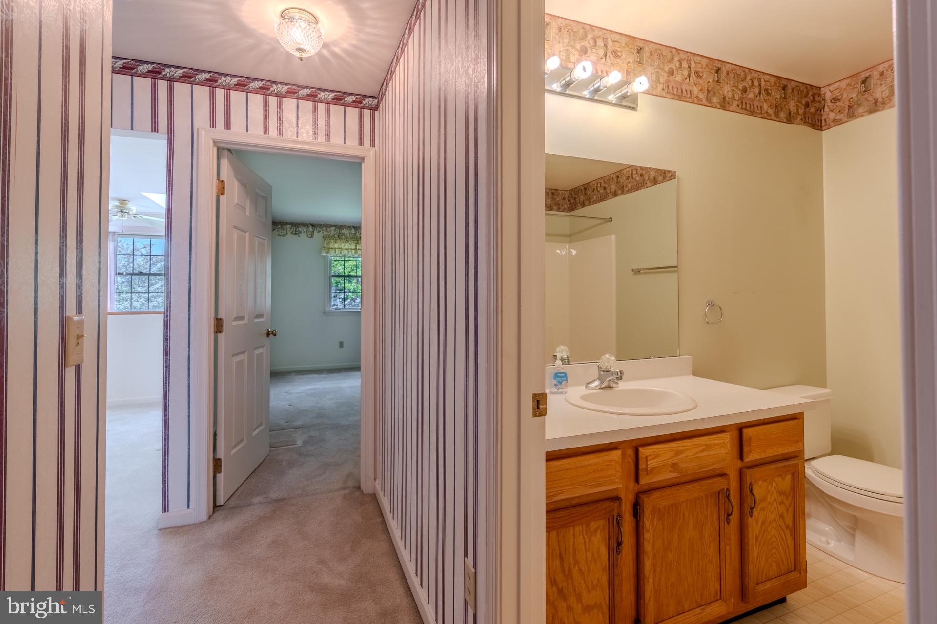 305 Stonegate Road York, PA 17408 - Photo 24 of 38 Charming hallway with bathroom access.