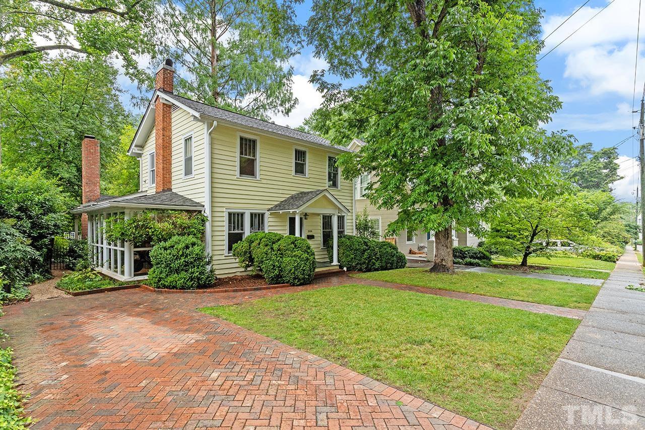 2001 McCarthy Street Raleigh, NC 27608 - Photo 2 of 43 a front view of a house with a yard and potted plants