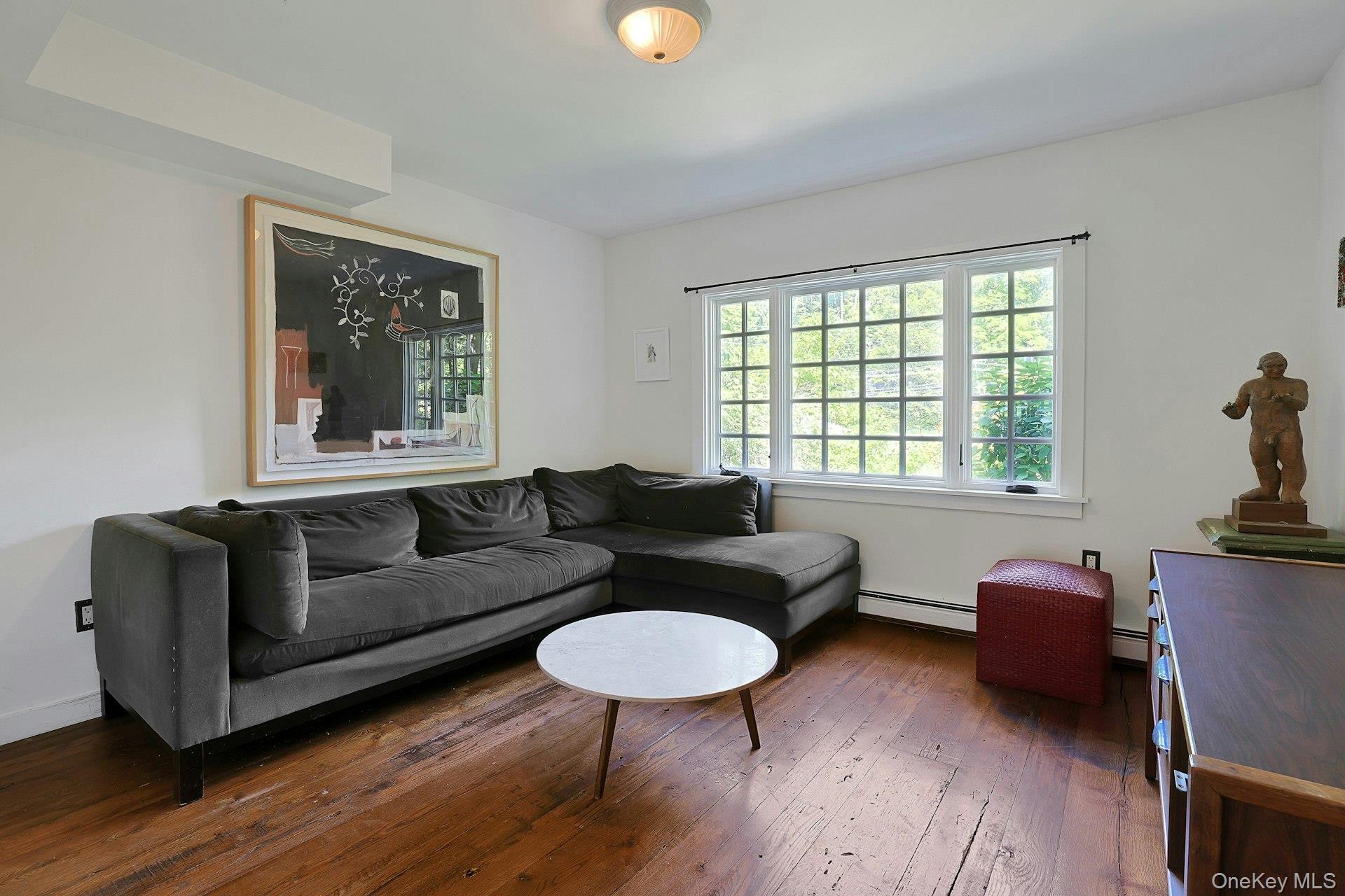 65 Douglas Road Chappaqua, NY 10514 - Photo 10 of 41 Sunlight highlights the rich hardwood floors in this spacious family room, creating a bright and welcoming setting