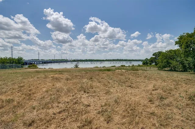 a view of a lake with houses in the background