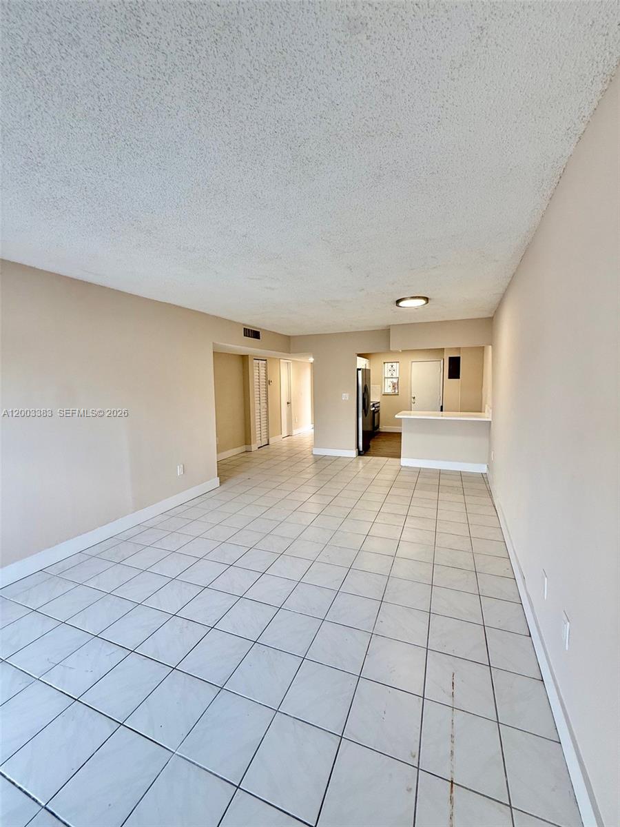 1950 West 54th Street, Unit 115 Hialeah, FL 33012 - Photo 16 of 28 a view of an empty room and window