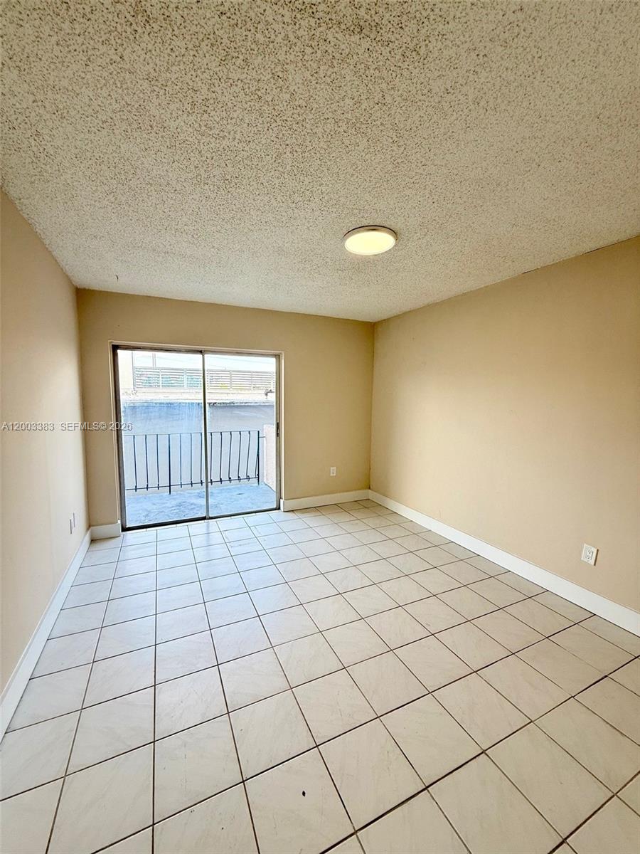 1950 West 54th Street, Unit 115 Hialeah, FL 33012 - Photo 17 of 28 a view of an empty room and a window