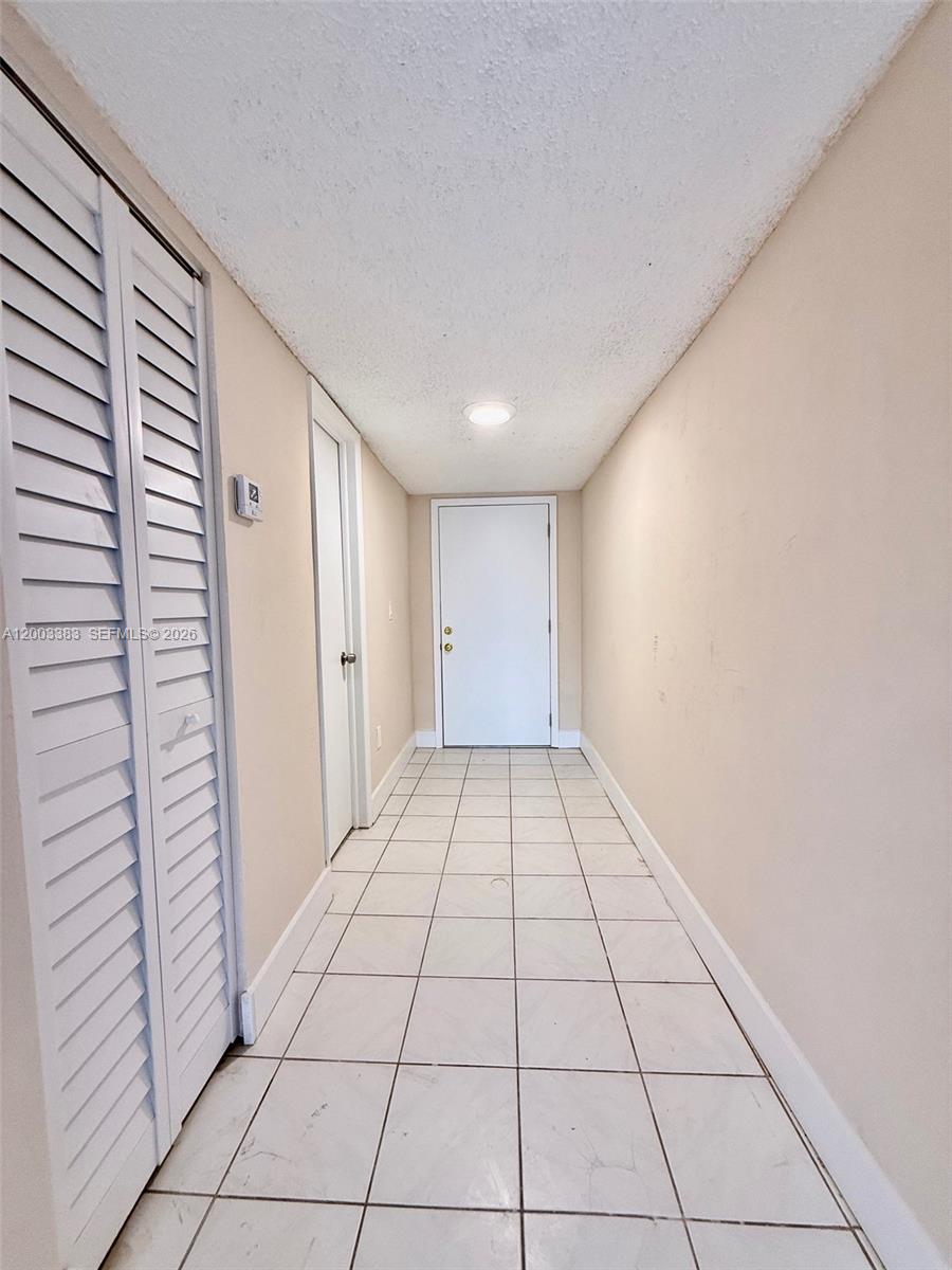 1950 West 54th Street, Unit 115 Hialeah, FL 33012 - Photo 22 of 28 a view of an empty room and window