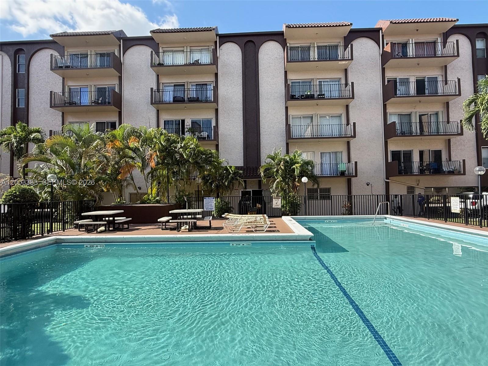 1950 West 54th Street, Unit 115 Hialeah, FL 33012 - Photo 26 of 28 a front view of multiple houses with yard