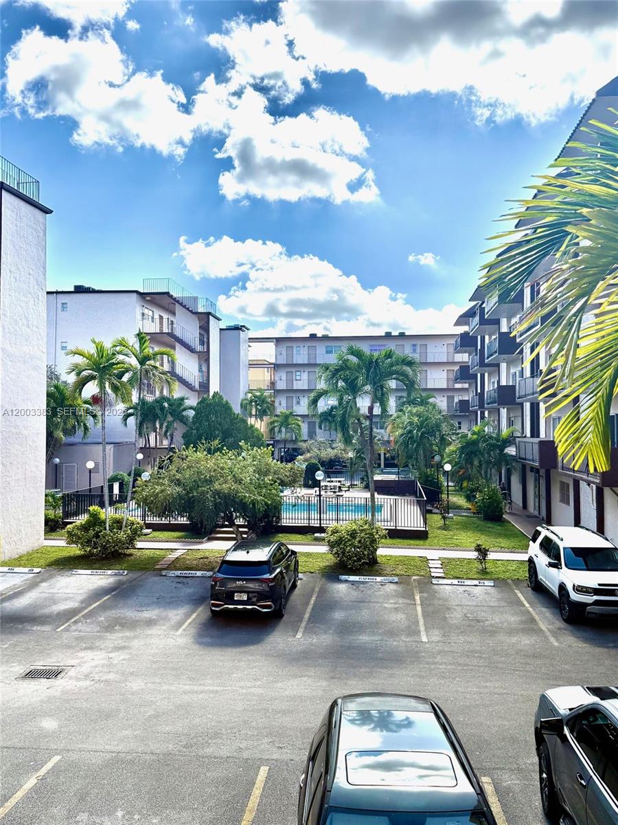 1950 West 54th Street, Unit 115 Hialeah, FL 33012 - Photo 7 of 28 a car parked in front of a building