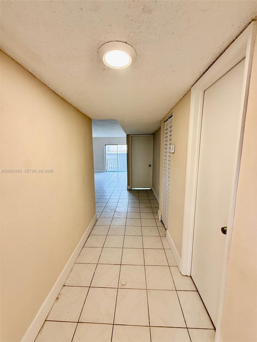 1950 West 54th Street, Unit 115 Hialeah, FL 33012 - Photo 9 of 28 a view of a livingroom with an empty space and a window