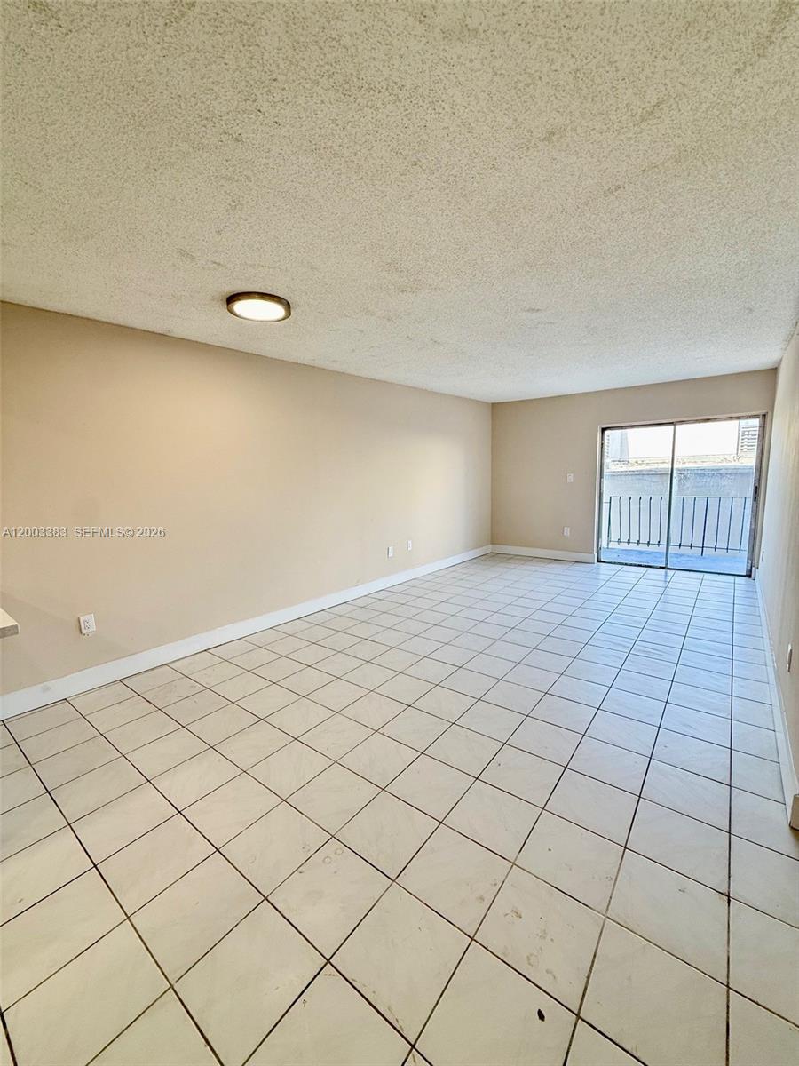 1950 West 54th Street, Unit 115 Hialeah, FL 33012 - Photo 10 of 28 an empty room with windows