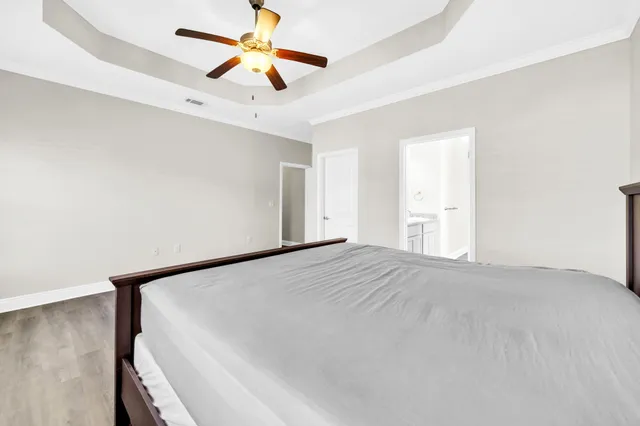 a view of empty room with ceiling fan