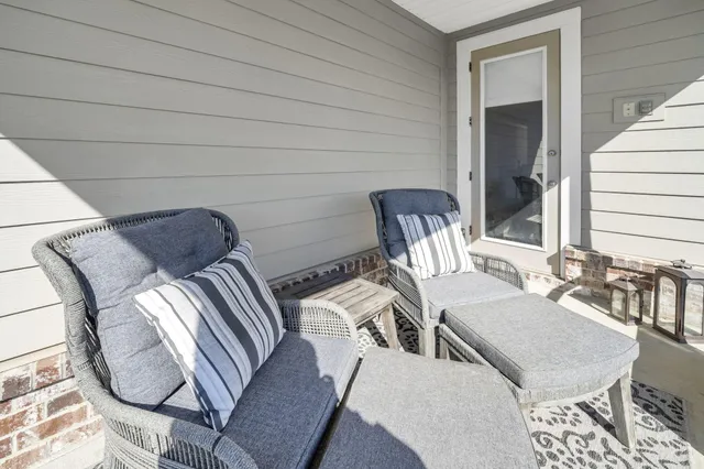 a view of a garden with a bench in the back yard