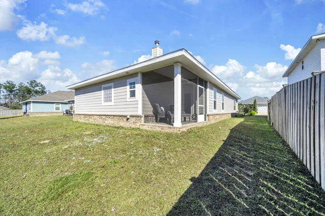 an aerial view of a house with a garden