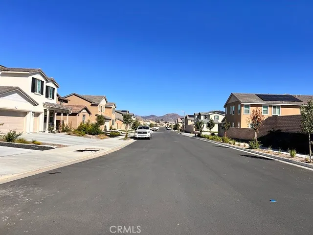a view of a street with cars