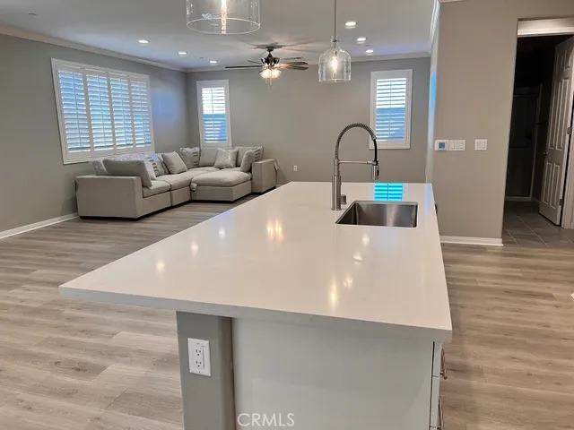 a large white kitchen has a large window