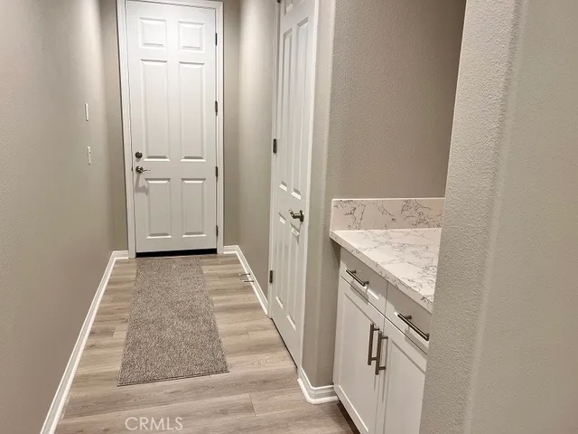 wooden view of a storage and utility room in empty room