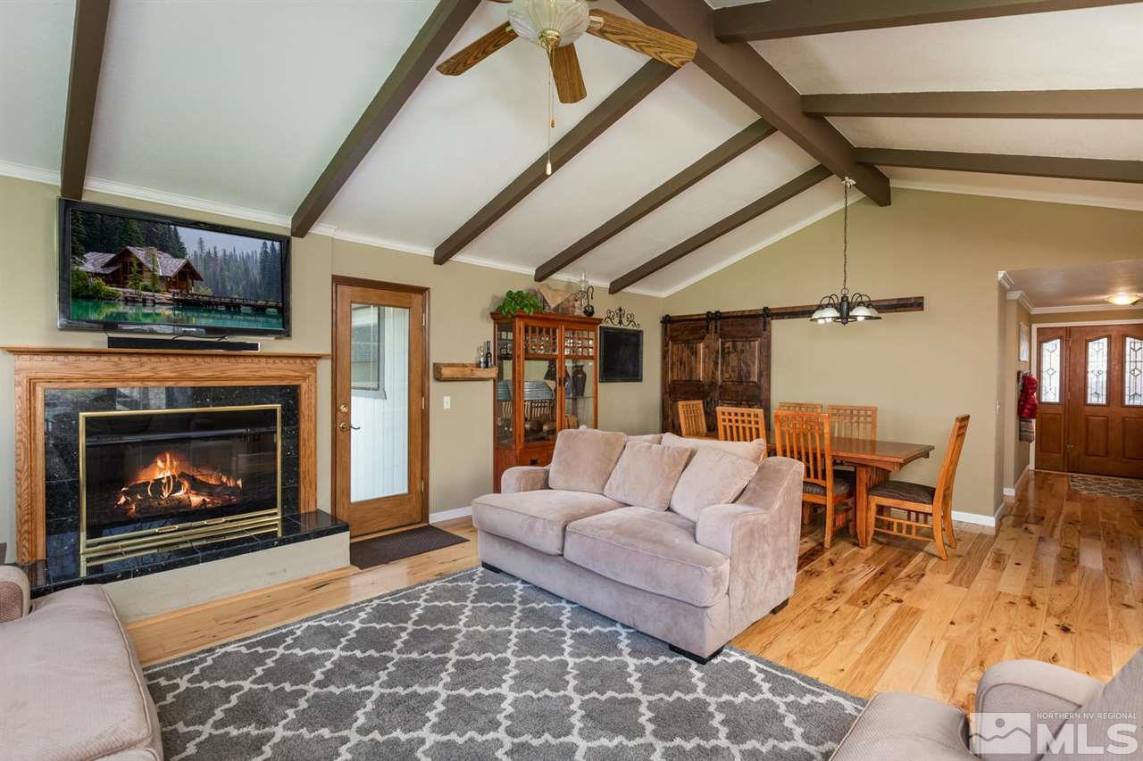 20875 Ames Lane Reno, NV 89521 - Photo 8 of 25 a living room with furniture and a fireplace
