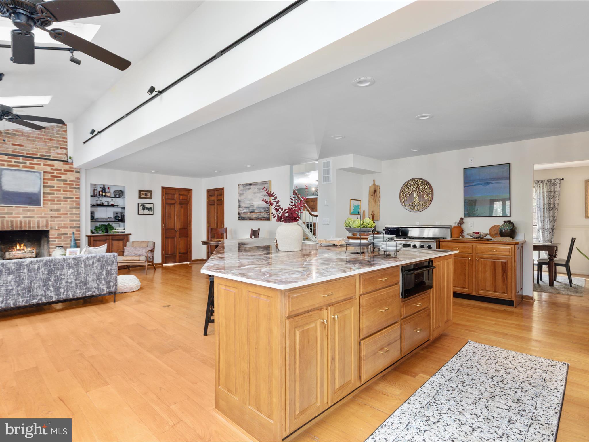 7261 Baldwin Ridge Road Warrenton, VA 20187 - Photo 14 of 76 a kitchen with stainless steel appliances granite countertop a stove and a view of living room