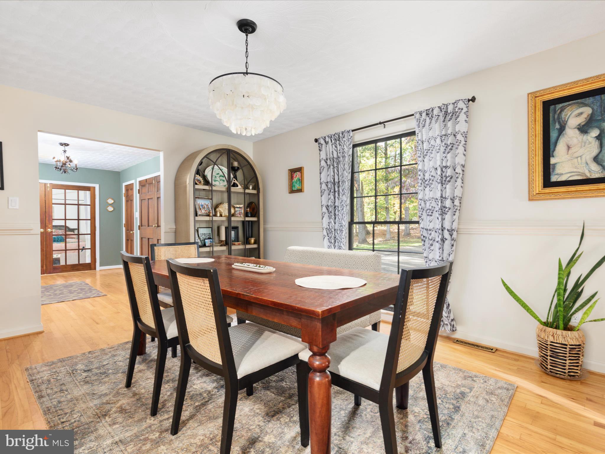 7261 Baldwin Ridge Road Warrenton, VA 20187 - Photo 29 of 76 a view of a dining room with furniture and wooden floor