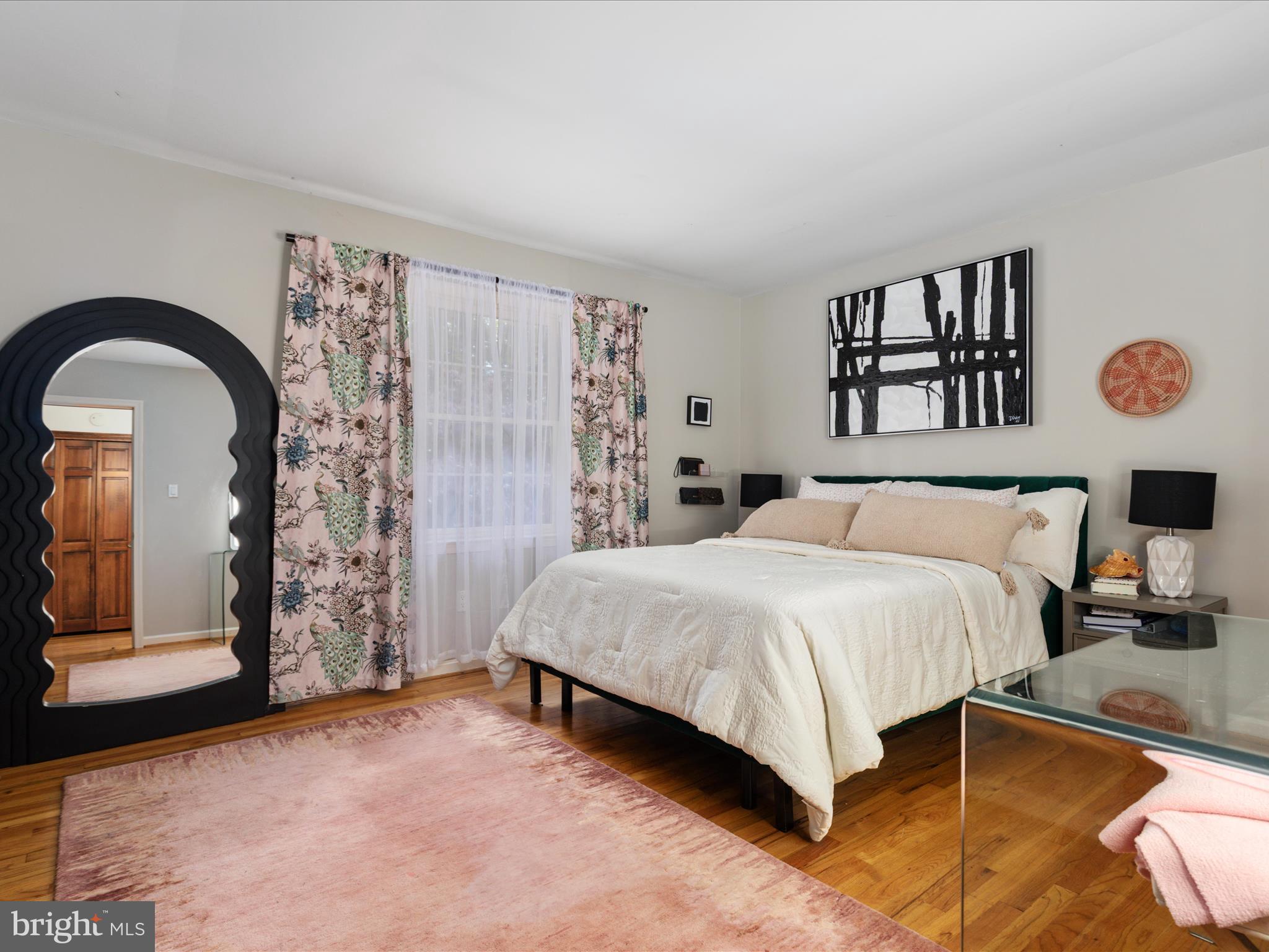 7261 Baldwin Ridge Road Warrenton, VA 20187 - Photo 39 of 76 a bedroom with a bed and a painting on the wall