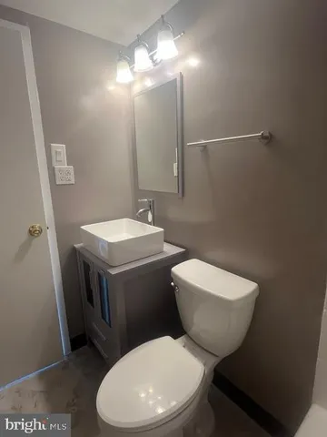 a bathroom with a toilet and a bathtub