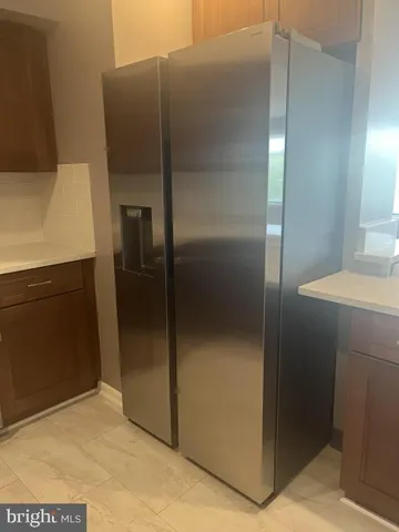 a bathroom with a shower and a sink