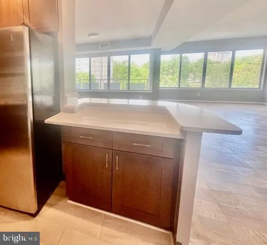 a bedroom with bed and a window