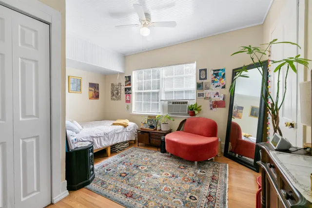 a bed room with a bed and a chandelier