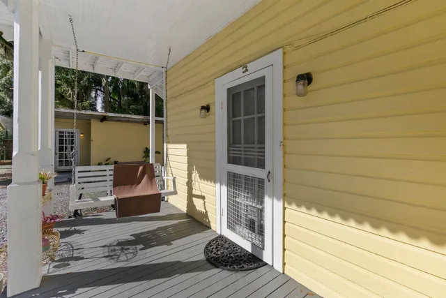 a kitchen with granite countertop a refrigerator and a sink