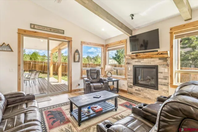 a view of a livingroom with furniture and workspace