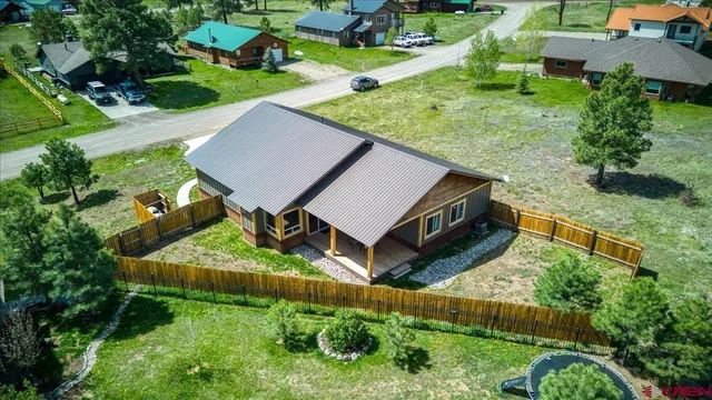 an aerial view of a house having yard