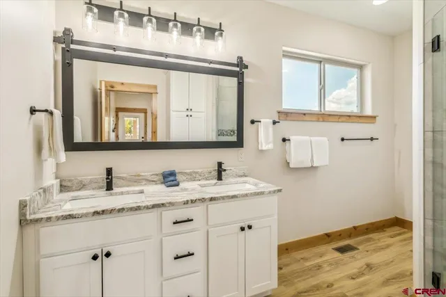 a bathroom with a bathtub and shower