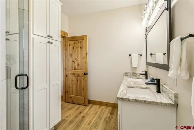 a view of a bathroom from a hallway