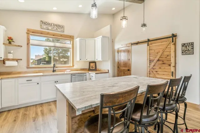 a view of a living room and dining room