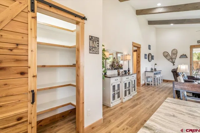 a view of a dining room with furniture wooden floor and chandelier