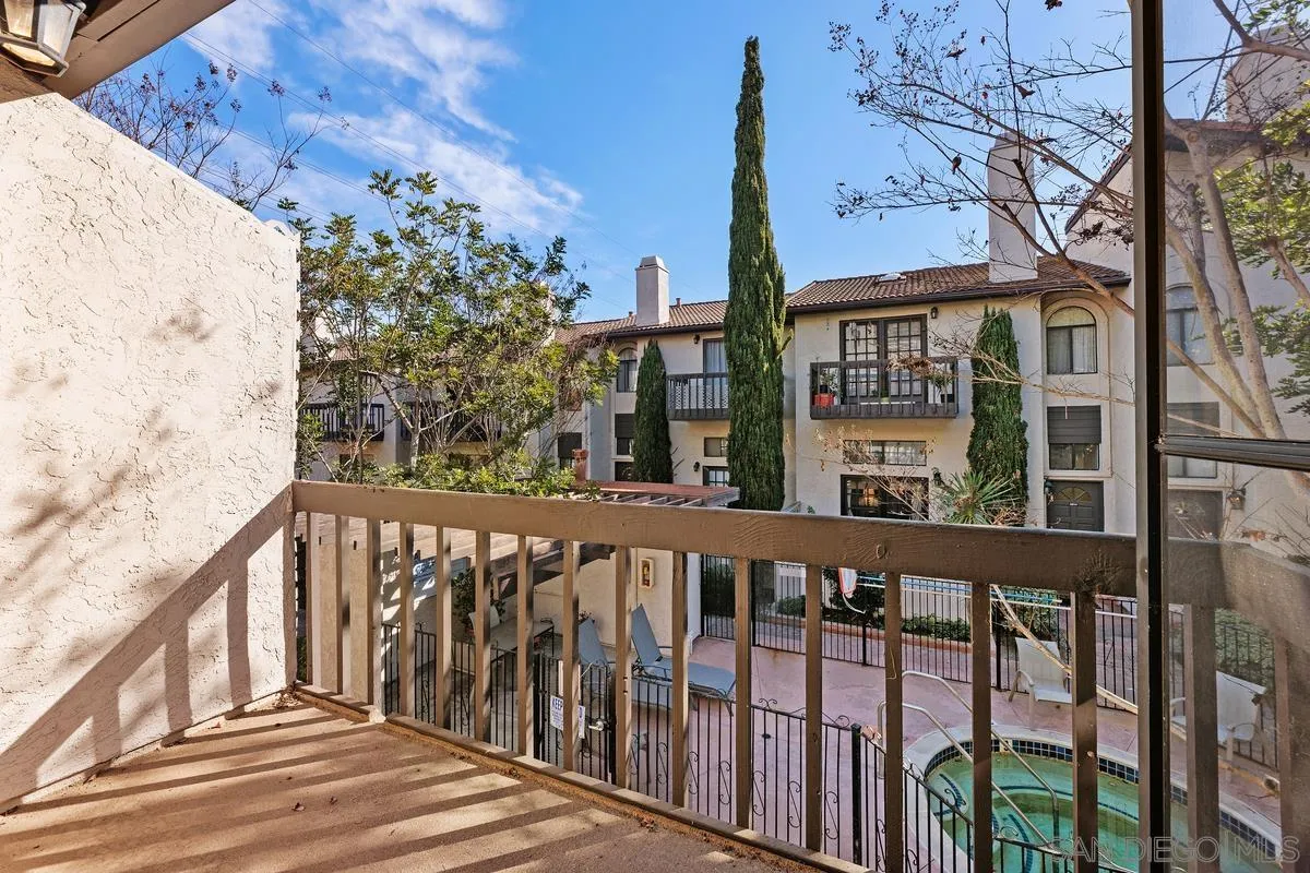 2364 Altisma Way, Unit B Carlsbad, CA 92009 - Photo 12 of 26 a view of a brick house with large windows