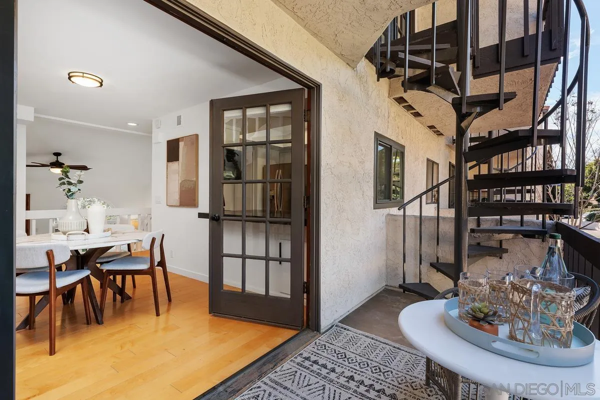 2364 Altisma Way, Unit B Carlsbad, CA 92009 - Photo 2 of 26 a dining room with furniture and a table
