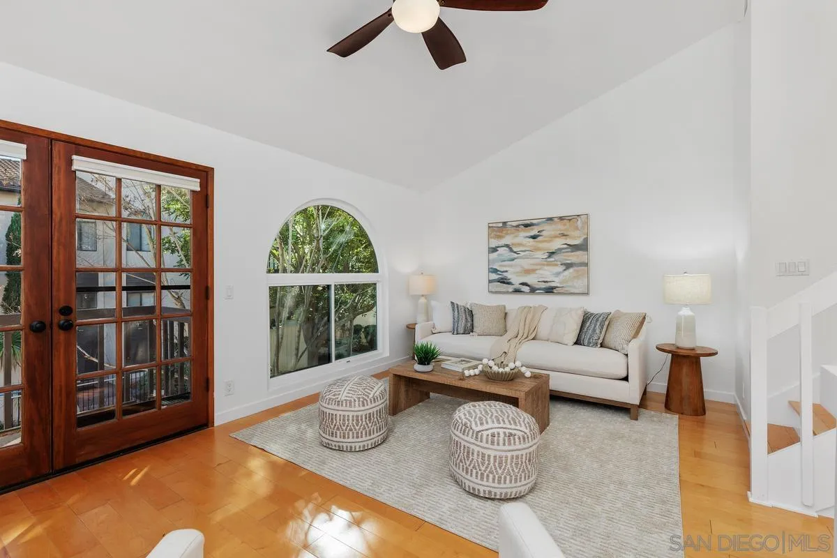 2364 Altisma Way, Unit B Carlsbad, CA 92009 - Photo 10 of 26 a living room with furniture and a large window