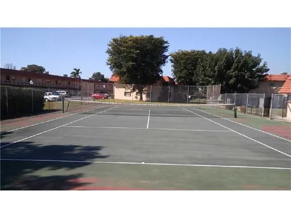 a black and white photo of a tennis court