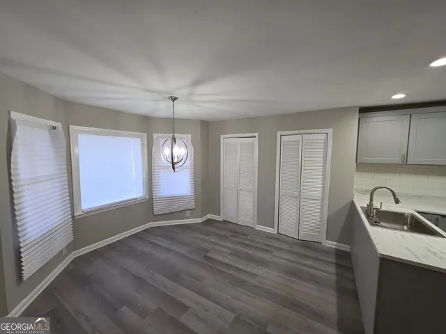 a view of a kitchen with a sink cabinets and a window