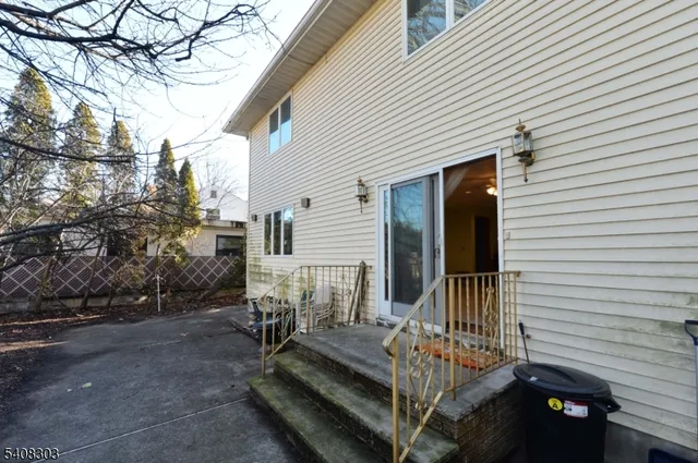 a view of backyard with sitting area
