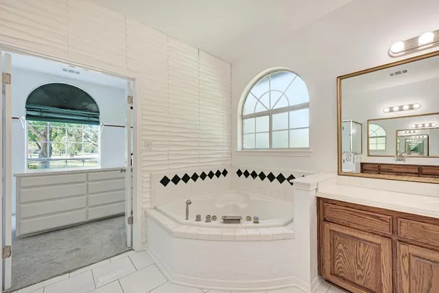 a bathroom with a bathtub and a sink