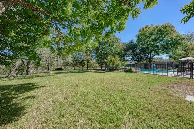 a view of outdoor space with deck and yard