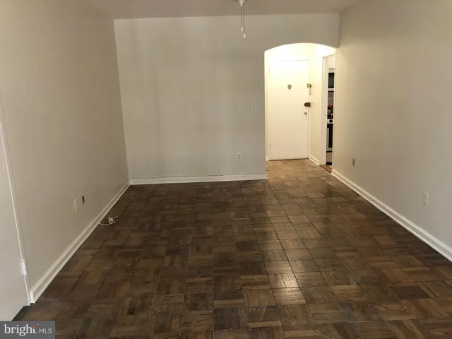an empty room with wooden floor